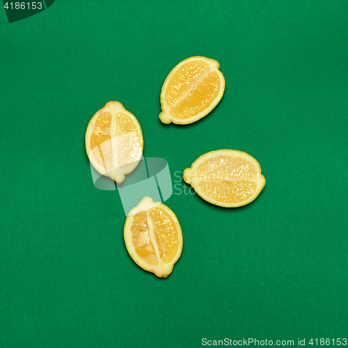Image of Lemons on green background