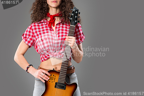 Image of The cowgirl fashion woman over a gray background