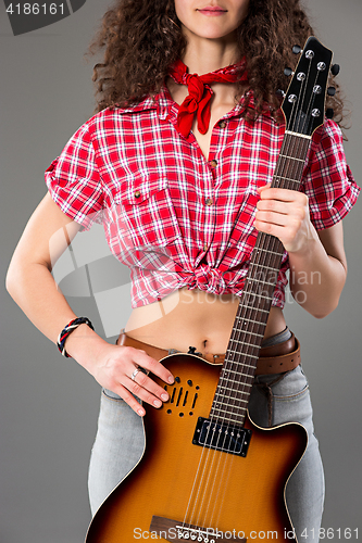 Image of The cowgirl fashion woman over a gray background