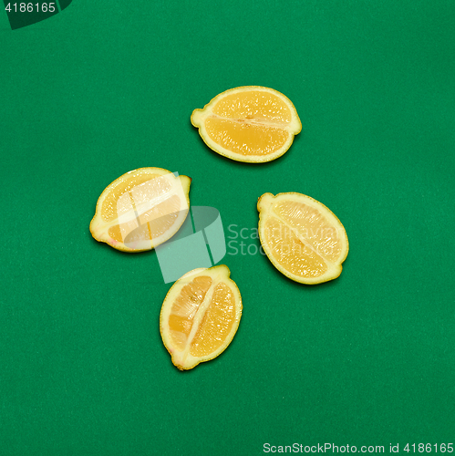 Image of Lemons on green background