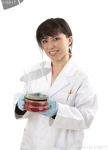 Image of Scientist carrying petri dishes