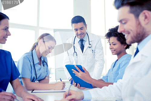 Image of group of happy doctors meeting at hospital office