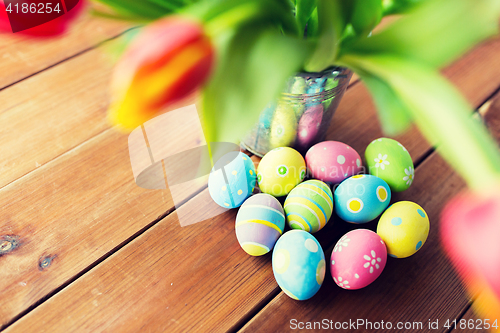 Image of close up of easter eggs and flowers in bucket