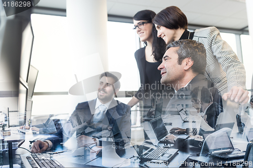 Image of Business team working in corporate office.