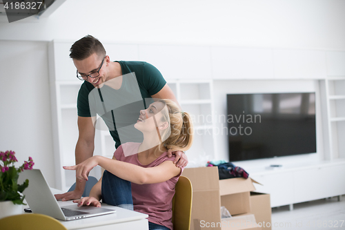 Image of Young couple moving in a new home