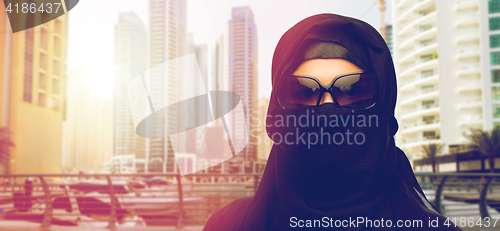 Image of muslim woman in hijab and sunglasses at dubai city