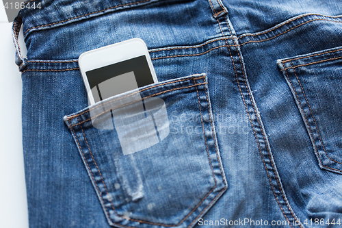 Image of smartphone in pocket of denim pants or jeans