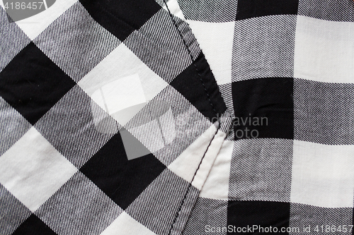 Image of close up of checkered clothing item with pocket