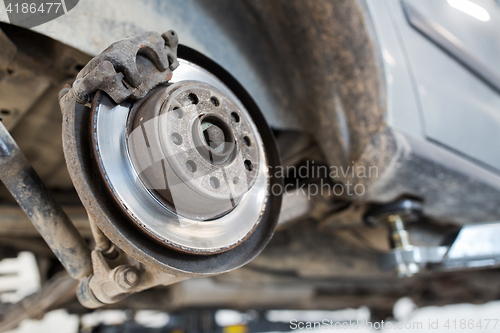 Image of car brake disc at repair station