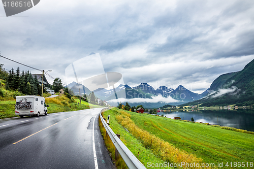 Image of Caravan car travels on the highway.