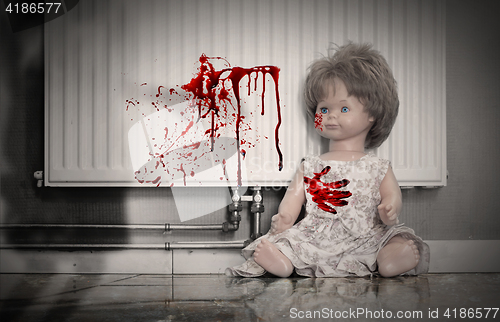 Image of Concept of child abuse - Bloody doll