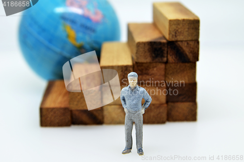 Image of Way to success with  businessman and wood block step