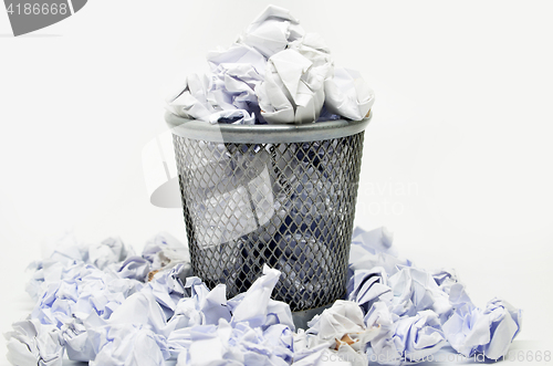 Image of Garbage bin with paper waste