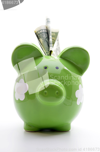 Image of Green piggy bank with US dollar bills