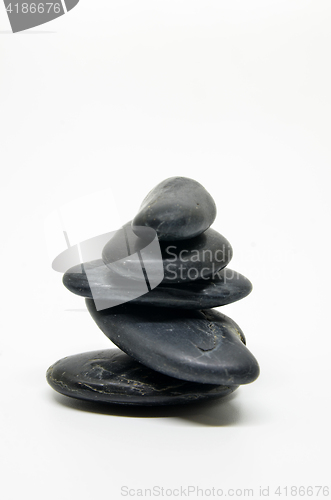 Image of  Five black stones balanced isolated 