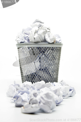 Image of Garbage bin with paper waste