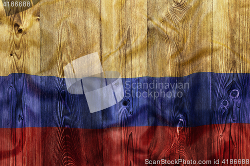 Image of National flag of Colombia, wooden background