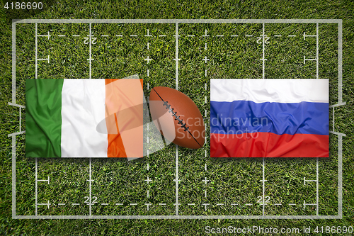 Image of Ireland vs. Russia\r flags on rugby field