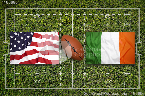 Image of USA vs. Ireland flags on rugby field