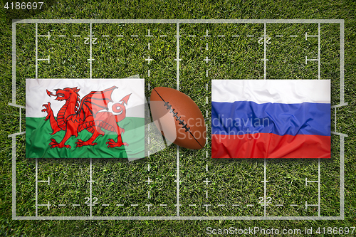 Image of Wales vs. Russia flags on rugby field