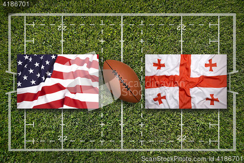 Image of USA vs. Georgia flags on rugby field