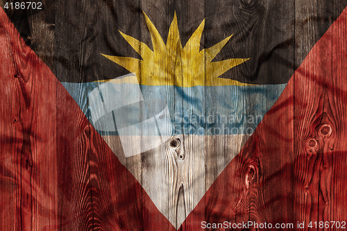 Image of National flag of Antigua Barbuda, wooden background