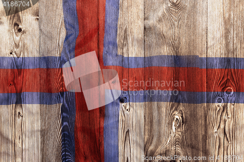 Image of National flag of Faroe Islands, wooden background