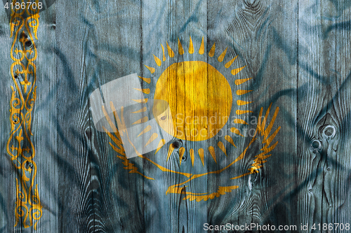 Image of National flag of Kazakhstan, wooden background