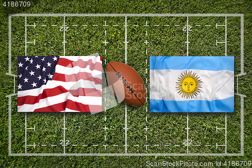 Image of USA vs. Argentina flags on rugby field