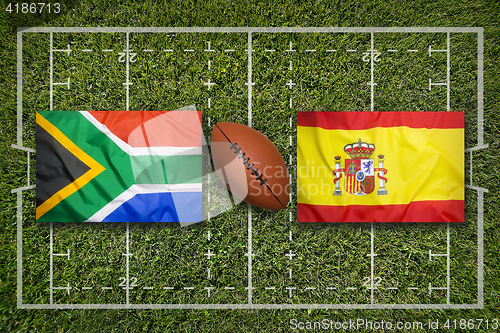 Image of South Africa vs. Spain flags on rugby field