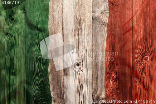 Image of National flag of Italy, wooden background