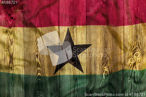 Image of National flag of Ghana, wooden background