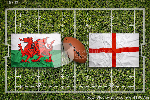 Image of Wales vs. England flags on rugby field