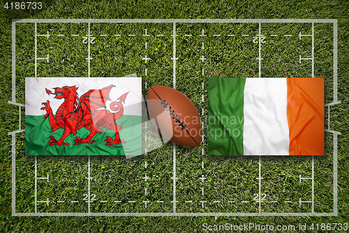 Image of Wales vs. Ireland flags on rugby field