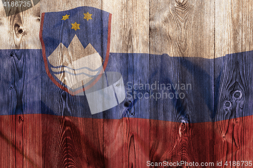 Image of National flag of Slovenia, wooden background