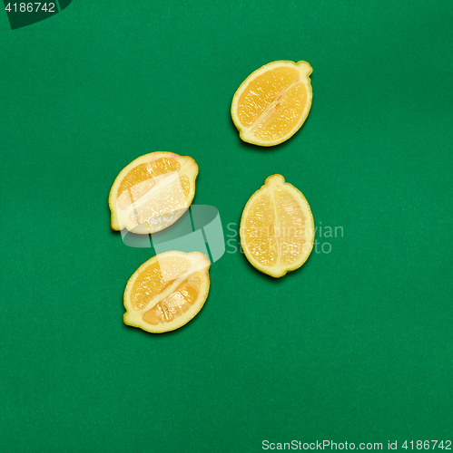 Image of Lemons on green background