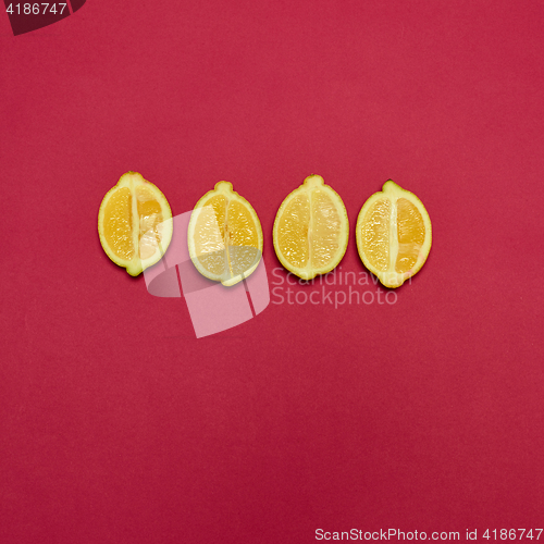 Image of Lemons on red background