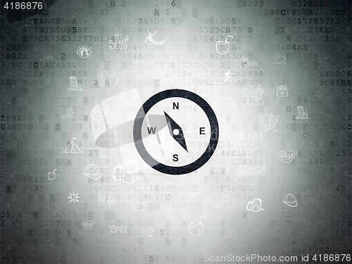 Image of Vacation concept: Compass on Digital Data Paper background