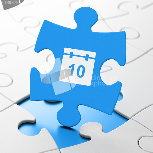 Image of Time concept: Calendar on puzzle background
