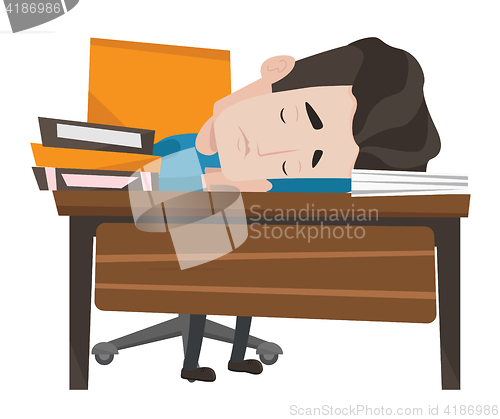 Image of Male student sleeping at the desk with book.