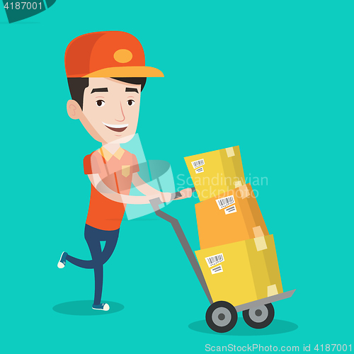 Image of Delivery postman with cardboard boxes on trolley.