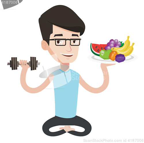 Image of Healthy man with fruits and dumbbell.