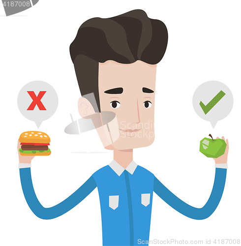 Image of Man choosing between hamburger and cupcake.