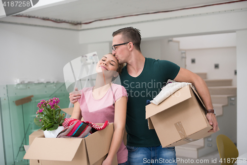 Image of young couple moving into a new home