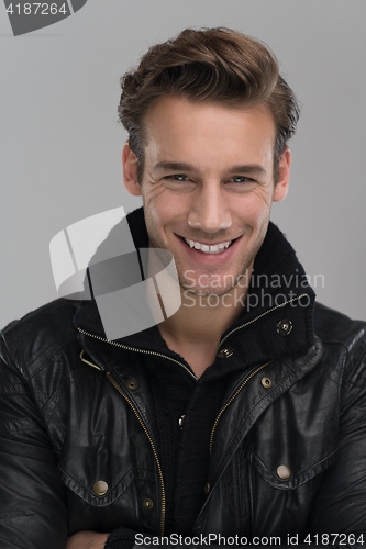 Image of portrait of a young guy over gray background