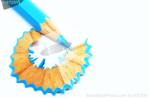 Image of Sharpened blue color pencil and wood shavings