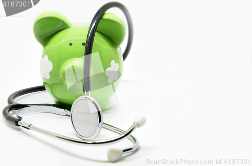 Image of Piggy bank and stethoscope 