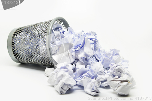 Image of Garbage bin with paper waste