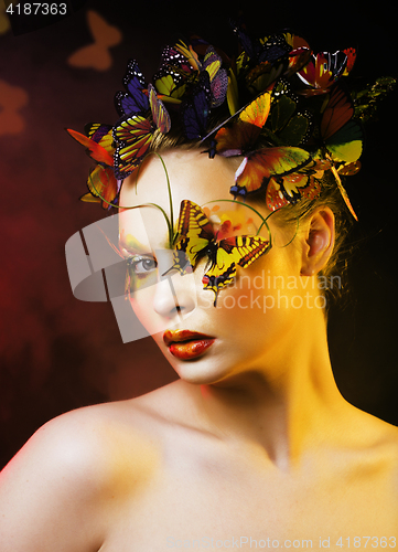 Image of woman with summer creative make up like fairy butterfly closeup 