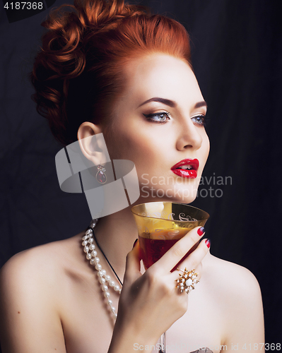 Image of beauty stylish redhead woman with hairstyle and manicure wearing